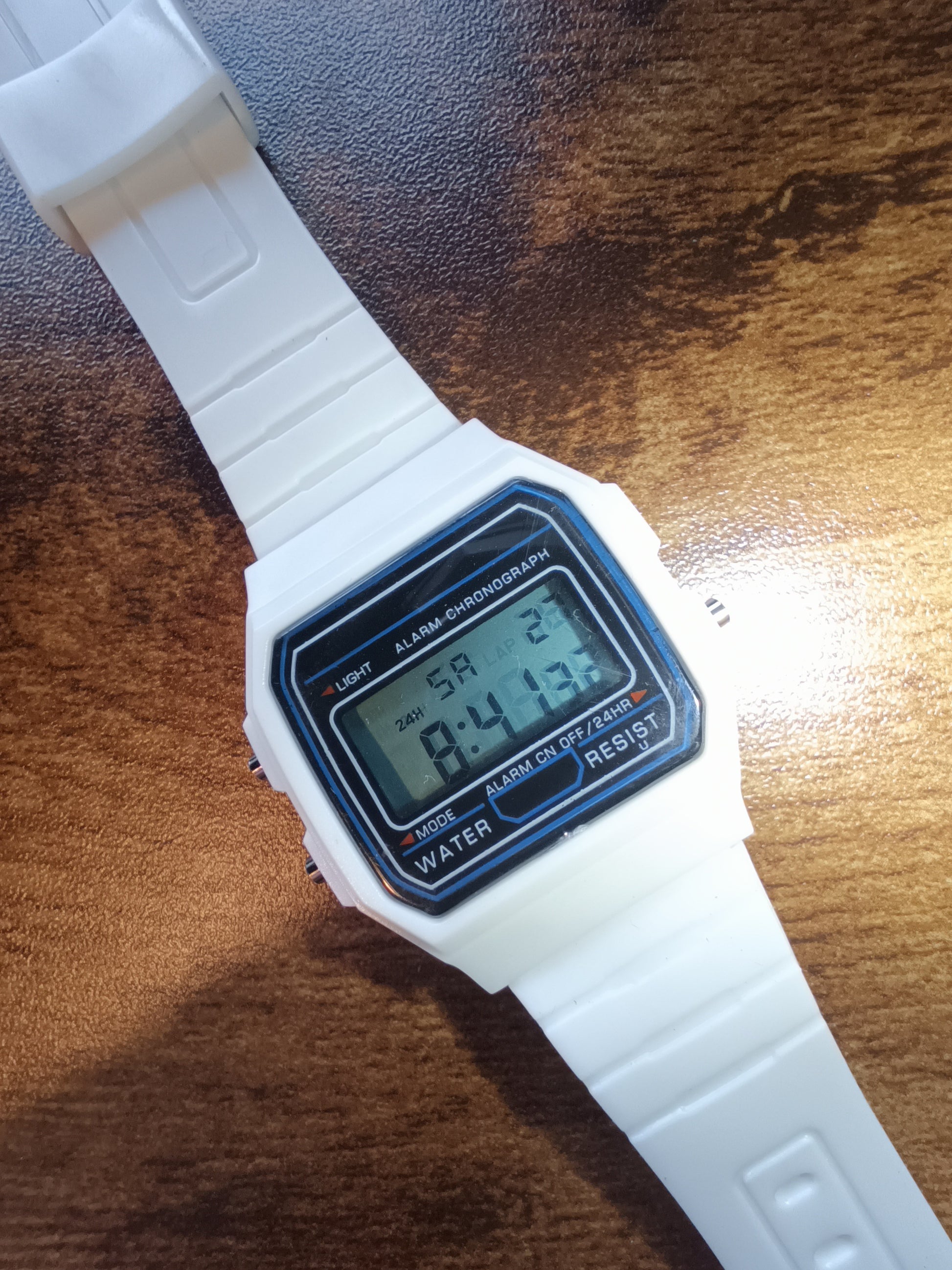 White Casio style watch with blue screen mod